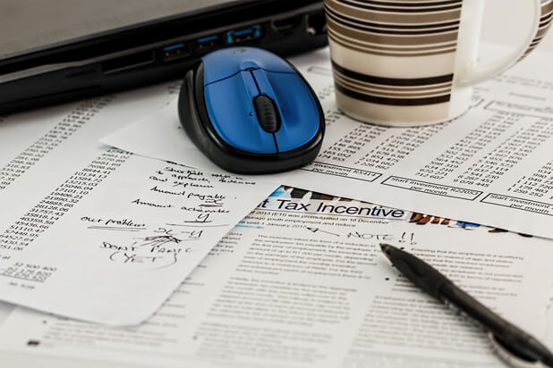 Cup and mouse on papers